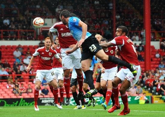 Bradford Telegraph and Argus: Rory McArdle heads home a late equaliser at Bristol City in 2013. Picture: Mike Simmonds.
