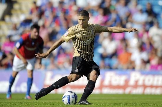 Bradford Telegraph and Argus: Nahki Wells scores a consolation penalty at Gillingham in 2012. Picture: Ady Kerry.