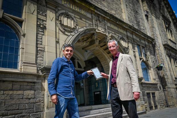 Bradford Telegraph and Argus: Charlie Studdy, right, outside Keighley Library with Patrick Hill, Library Team Leader, Bradford Council