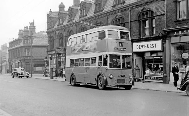 Bradford Telegraph and Argus: 596 on Thornton Road in November 1953, followed by a police car
