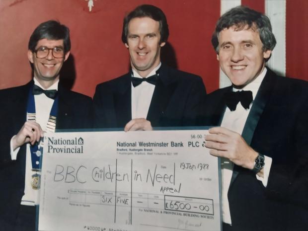 Bradford Telegraph and Argus: Alan Wormwell of Queensbury Round Table, David Howes and Harry with Children in Need cheque in 1988