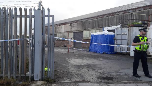 Bradford Telegraph and Argus: A police tent has been put up inside the industrial estate on Thornbury Road