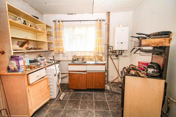 Bradford Telegraph and Argus: The kitchen of the house in need of modernisation 