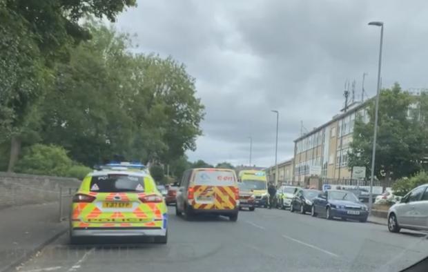 Bradford Telegraph and Argus: Police and ambulance outside Wibsey Park this evening