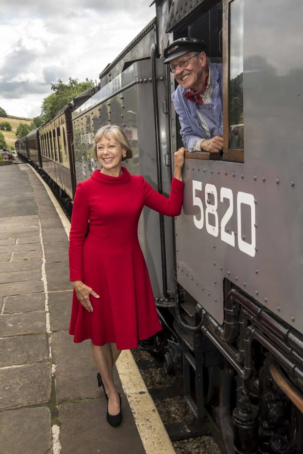 Bradford Telegraph and Argus: Jenny Agutter at Oakworth Station this week, with train driver Nick Hellewell. Pic: Chris Payne