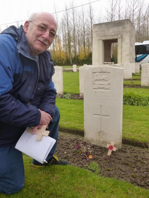 Bradford Telegraph and Argus: Ray at grave of a former Marshfield School pupil in a war cemetery in France 