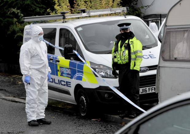 Bradford Telegraph and Argus: Forensics at the scene following Miss Walker's death