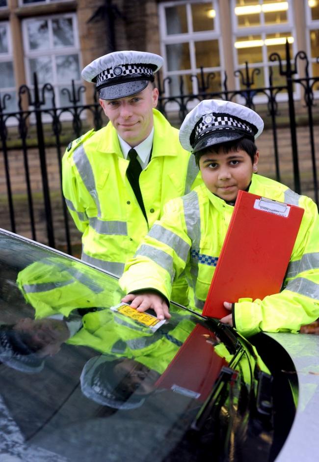 Pictured on patrol at Green Lane Primary school are Sgt Barron and Shahbaz Khalid, ten