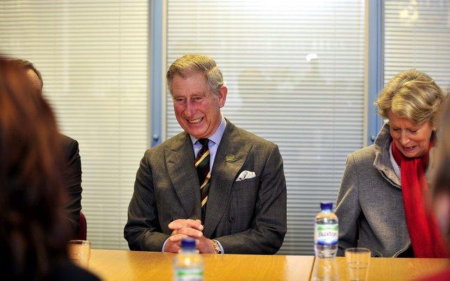 Prince Charles chats with students on a tour of Belle Vue Girls' School.