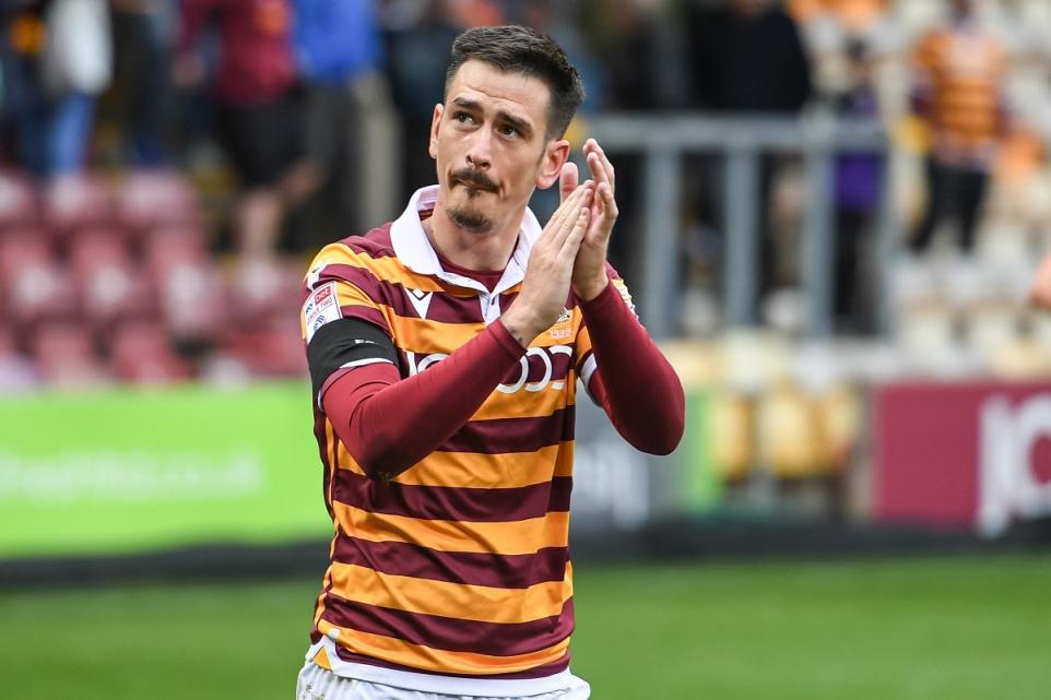 Bradford Telegraph and Argus: Jamie Walker claps the City fans after the Harrogate game