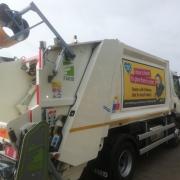 One of the Kirklees Council bin wagons with the foster carer recruitment message on the side