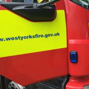 Fire service personnel released a female trapped in a vehicle following a crash in Hipperholme