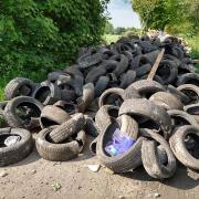 Tyres block the footpath down to the nature reserve