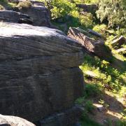 A Bradford woman fell from this rock at Shipley Glen yesterday