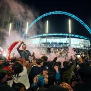 England fans celebrate outside Wembley after reaching the final. Picture: Zac Goodwin/PA Wire