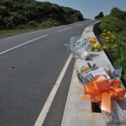 Several bunches of flowers from the man's family were left at the scene