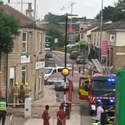 Bradford Road, Stanningley, was cordoned off while crews dealt with a fire at a Chinese restaurant this afternoon
