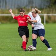 Tyersal’s Nikki Relton (in red) and Skipton Town’s Corina Riley vie for the ball in their re-arranged friendly, courtesy of H Baker Photography