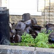 Plants were piled outside a Bradford home which was damaged by fire this morning
