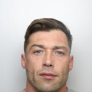 Convicted burglar Jonathan Cahill is wanted on recall to prison, and he's been stealing hearts on Facebook too
