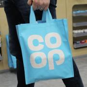A person carrying a Co-Op bag. Credit: PA