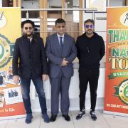 Shahid Afridi, left, with Regal Foods chief executive Younis Chaudhry and Adnan Siddiqui