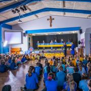 Children and staff at Our Lady & St Brendan’s Catholic Primary School dressed in blue and yellow and created messages of love and support. Pictures: RA Photography.