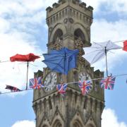 Photos of patriotic umbrellas outside City Hall for the Queen's Jubilee.