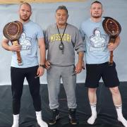 Jimmy Hawthorn with sons Brett (left) and Tommy (right) and their world titles.