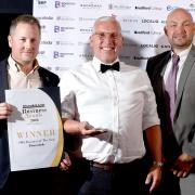 Simon Hobson (centre) and Jack Sutcliffe (left), of Power Sheds, after being named SME Business of the Year at the awards