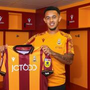 Dion Pereira shows off his City shirt after returning for a second loan spell