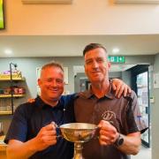 Ian Willis (left) on Sunday with the Champion Club trophy and his captain John Brear.