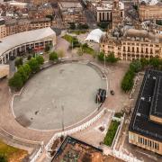 A view of Bradford city centre, showcasing City Park, the Mirror Pool, Bradford Magistrates' Court and City Hall