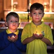 Wilsden siblings Rex and Rory Earley lit a candle for Queen Elizabeth II at St Saviours church in Harden.