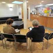 Patients sitting in the waiting room of a GP Practice. Picture: PA, Anthony Devlin
