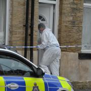 A cordon was in place on Shetcliffe Lane, Bradford, while police carried out an investigation after the discovery of a body