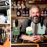 Landlord Edward Kellet shows the wide selection of beers on offer at the Black Rat