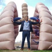 Dr Chris George, NHS medical doctor, beside a large inflatable lung at St Thomas' Hospital in central London, during the launch of the Let's Talk Lung Cancer Roadshow, a national tour of the world's first walk-through lung exhibit. Picture: PA