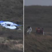 A police forensic tent that looks to have been lowered on Saddleworth Moor and police officers and other emergency personnel on the Moors. Picture: Telegraph & Argus