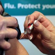 A patient receiving the seasonal flu vaccine, pictured above, as the NHS in England issues its flu jab call