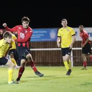Campion were indebted to Patrick Sykes (red and black, striking the ball) on Saturday, as he set up their opening goal and scored their late clincher. Picture: Alex Daniel.