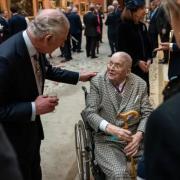 King Charles III speaks to artist David Hockney