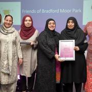 Dr Soo Nevison Ceo from Bradford Community Action presents the Voluntary and Community Group to Friends of Bradford Moor Park.