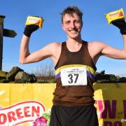 Nathan Lawson poses with his malt loaves after a comprehensive victory at the Stanbury Splash fell race. Picture: Dave Woodhead/WoodenTops.