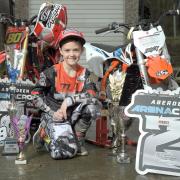 Bradford rider Roy Townley, 8, with some of the trophies he has won on the motocross circuit