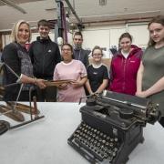 Heritage officer Alison McMaster at the Sunny Bank Mills Archive with students at West SILC