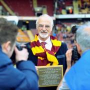 Professor David Sharpe pictured receiving a plaque from Bradford City in 2014