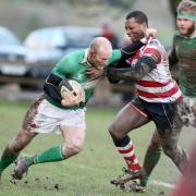 Bingley-born Dan Scarbrough (left) in the thick of the action for Wharfedale against Rosslyn Park in 2014, seven years after his second and final England cap.