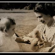 King Charles as a baby alongside the late Queen Elizabeth II, a photograph on display at the National Science and Media Museum