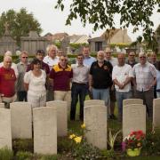 Members of the Bus to Bradford group paying their respects in France
